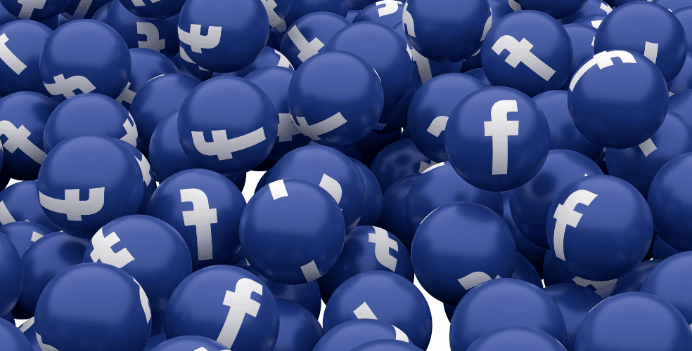 Numerose sfere con il logo di Facebook su di esse, rappresentando l'utilizzo massiccio di Facebook per il marketing e la promozione di servizi di web design.